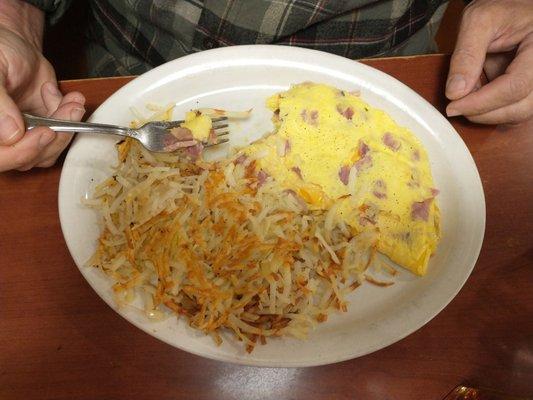 Spouse's ham and cheese omelette.  Cooked soft with American cheese - just like he likes it!  Great breakfast!