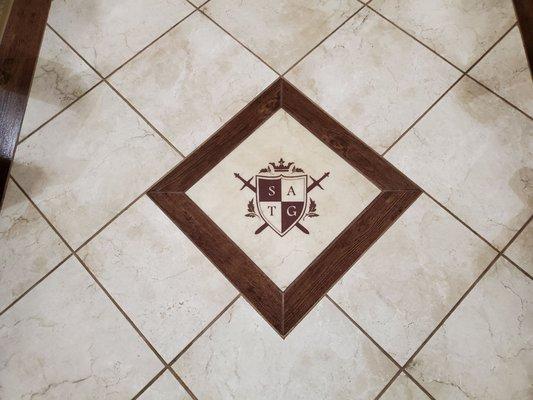 St. Albert the Great monogram in the tile floor