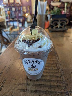 Iced latte - May special, Whomping Waffle, chocolate chip waffle flavored latte topped with whipped cream, chocolate chips, and mini waffle