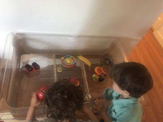 Kids at play in the water table