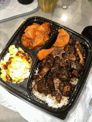 Oxtails with candied yams and mac and cheese