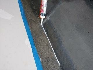 Sealing garage and caulking cement edges