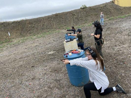 Private event class, duration of 4 hours. They are learning to shoot from different positions and utilize barriers for cover.