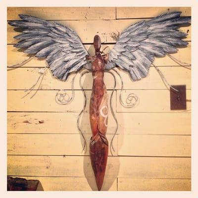 Known for his Angel figures, Kelly Guidry made this one unique from the others. She has carved wings with a carved body.