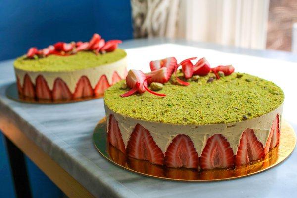 Pistachio fraisier featuring fresh strawberries, Tahitian vanilla bean, and pistachio sponge cake