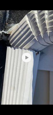 Damage by roofers to downspout