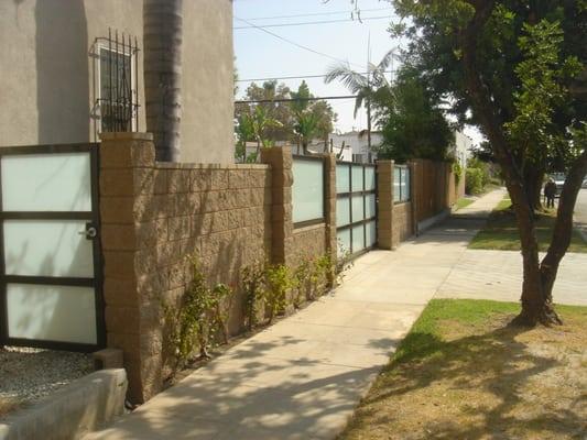 Gate installation and obscured glass panels were installed with a custom made gate and fences.