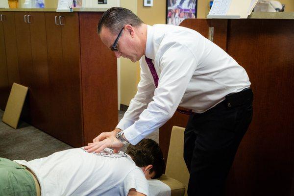 Dr. McEvoy checking for Spinal Misalignments