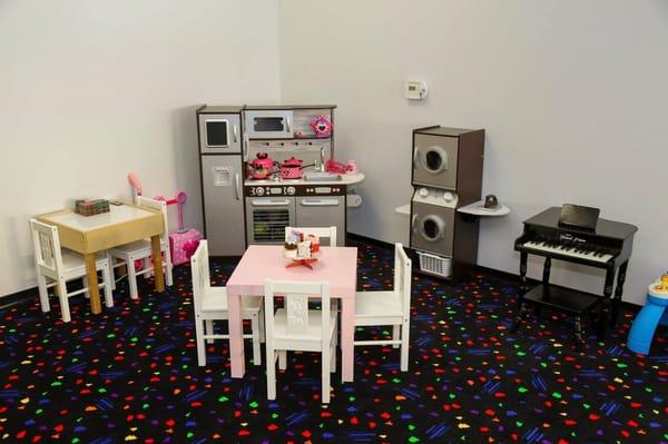 Kitchen and Laundry room play area.