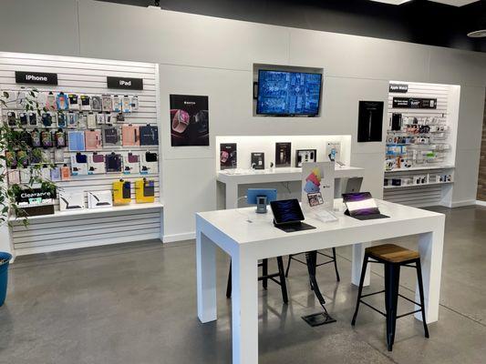 Inside store, near iPad and iPhone demos and accessories