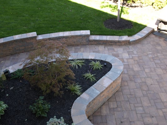 Retaining walls, plantings, and sod