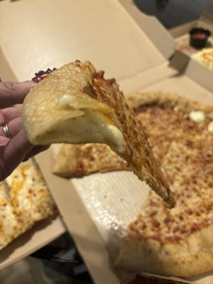 Stuffed crust paper thin under cooked pizza