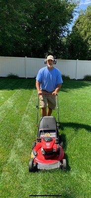 Hi im Frank owner of Tokarczyk Services of Muskegon push mowing one of our yards on Hendricks in Muskegon.