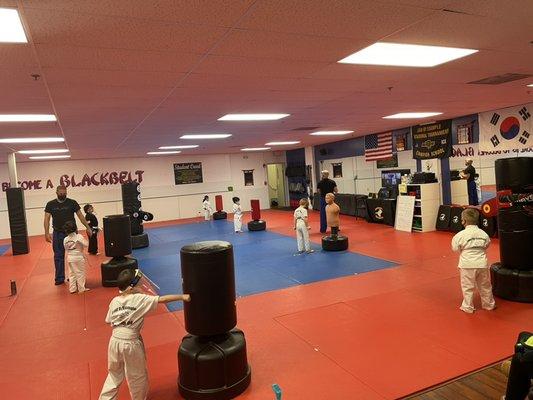 Practicing their punches on the bags.