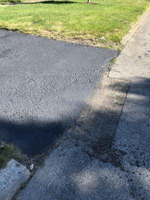 Cracking apron of the driveway they installed. Was told that when it was sealed, it would solve the cracking issues. It hasn't.