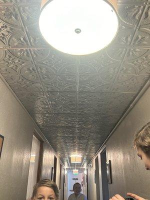 Detail of downstairs hallway ceiling to the dorm rooms.