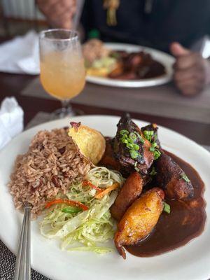 Jerk chicken dinner, curry chicken and mixed drink