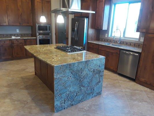 Beautiful Jaguar granite kitchen with waterfall on the island