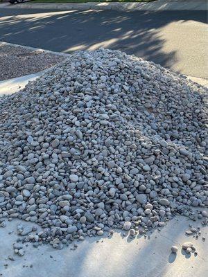 5 tons of river rock ready to xeriscape the yard!