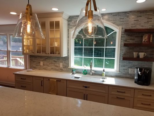 Kitchen remodel in West Chester.  New geometric window.  Open shelving.  Glass backsplash.