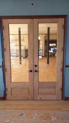 Custom mahogany double door at the Land and Water Company restaurant in Carlsbad California