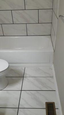 Tile we have done in bathroom on floor and backsplash of tub