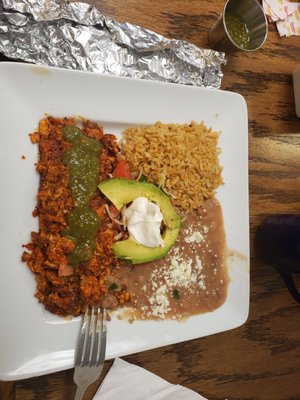 Chorizo and eggs ( I asked for green salsa and put it on top) rice,  beans