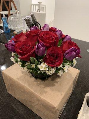 Purple tulips and red roses bouquet