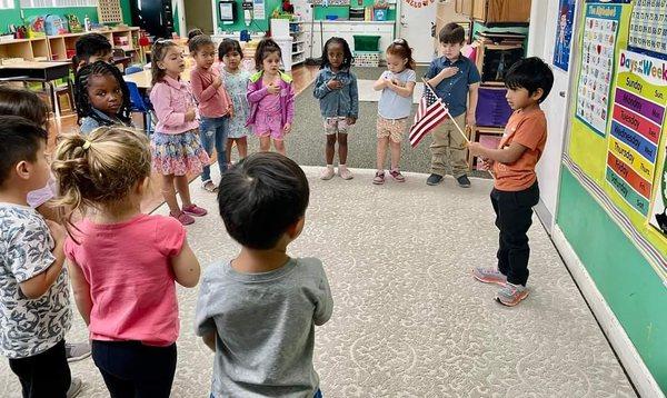 pledge of allegiance: each student gets a turn each day to hold the flag