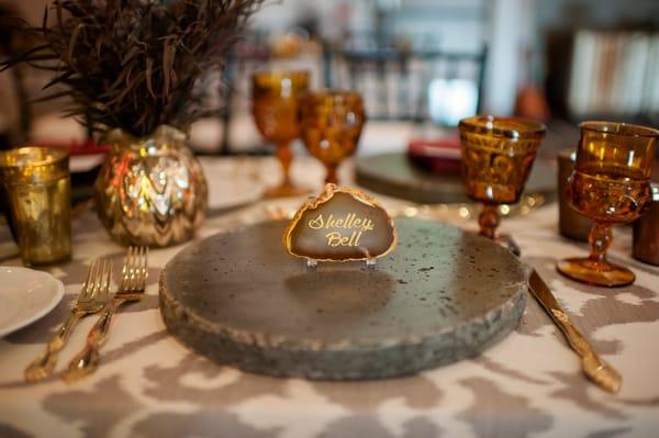 Custom Designed Bespoke Provisions made in house agate geode name cards and lava stone charger plates for a royal event.