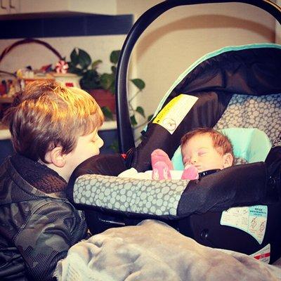 Logan Stockton peers at little sis Briley Lynn as they prepare to finally take her home from her extended stay in the Renown NICU.