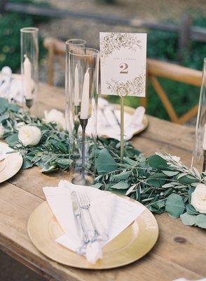 Table greenery, florals, and candles.