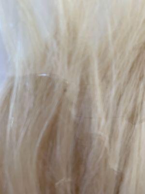 Another black dot in the hair.