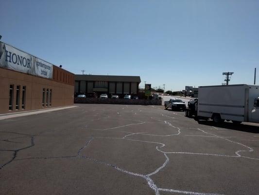 Repair Asphalt potholes, Crack Fill, Seal Coat, and Restripe Parking Lot.