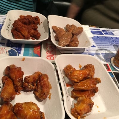 Four people four kinds of wings. Peanut butter and jelly , super hot, mango habanero, and general tso.