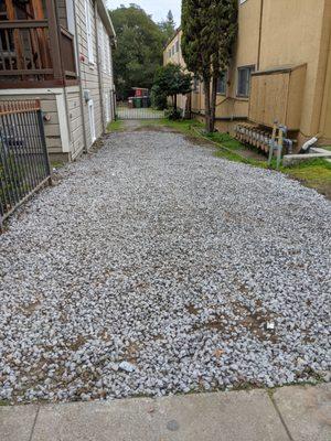 Driveway after the job was done. They put down fresh gravel.