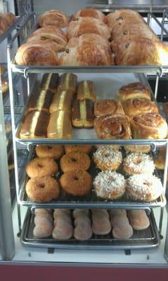 Jalapeno croissant, cinnamon rolls, glazed crumb donuts, glazed coconut donuts