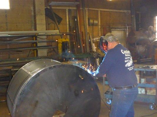 Our experienced welder working on welding metal pieces.