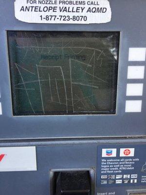 The screen is hardly readable with the scratched-in graffiti.  Also, the pump says it's printing a receipt, but where is it?!?!