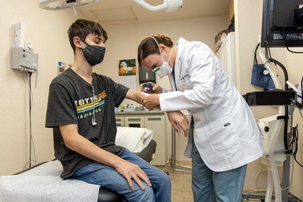 Brianne Dickey, MD, with patient at Redwood Family Dermatology