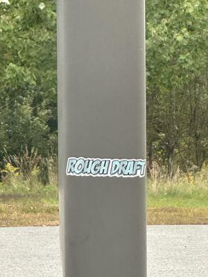 Sticker on the pole outside in the parking lot... makes sense. This whole dollar general is a "rough draft". The place is a zoo