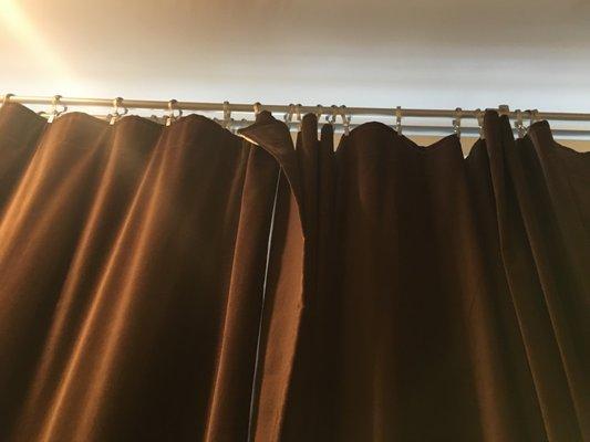 Drapes dirty and hung improperly