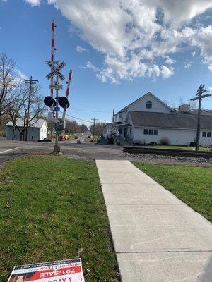 Whistle stop inn Out by the Railroad Crossing on a kind of summer day