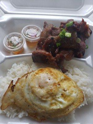 Pork tocino with white rice and fried egg with side of spicy vinegar