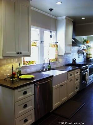 Oven, dishwasher and microwave units are Built In and complement the urban look of the kitchen along with almond colored doors