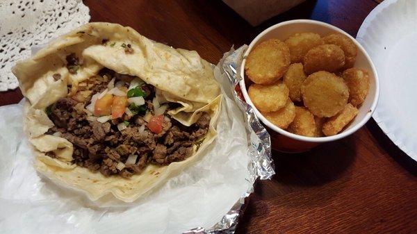 A delicious asada burrito from La Michoacana (potato Oles sold separately at Taco John's):