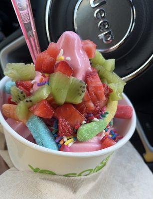 Strawberry and natural yogurt with sprinkles, gummy worms, kiwi, and strawberry