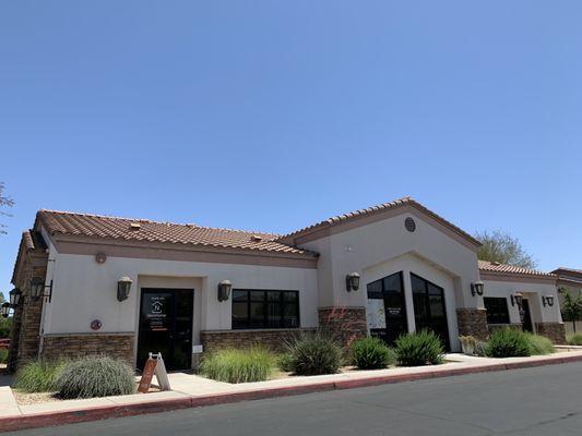 Second row buildings south of Brown; enter off Val Vista