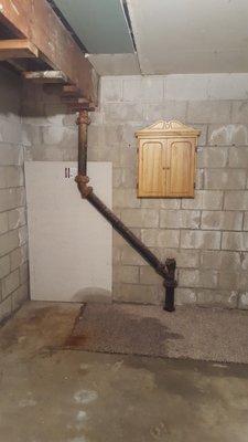 Rusted pipes lead to large leak in the car port