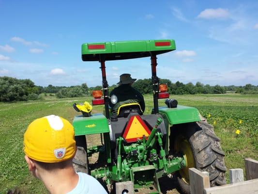 Riding the wagon to the berry patch.